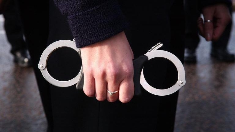 Police Officer with handcuffs