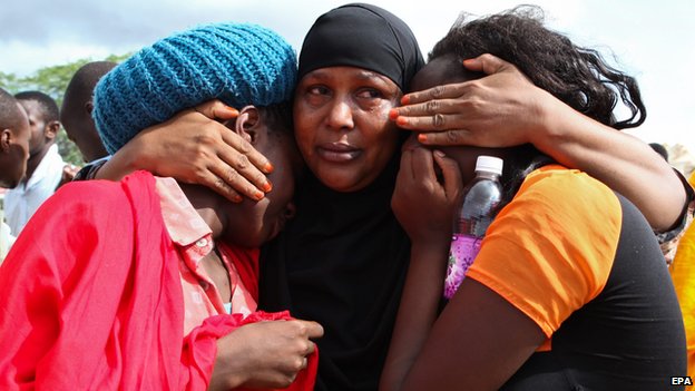 Some of the Garissa University students who were rescued, comfort each other at the Garissa military camp on 3 April 2015