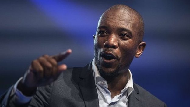 Mmusi Maimane, the newly elected leader of South Africa's main opposition party, gestures as he gives his maiden speech following his election in Port Elizabeth, South Africa, on 10 May 2015.