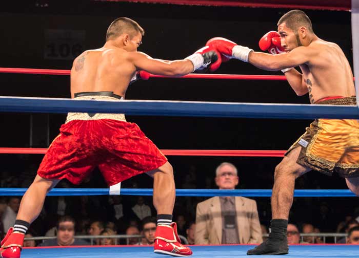 Boxers facing off in the ring at Atlantis