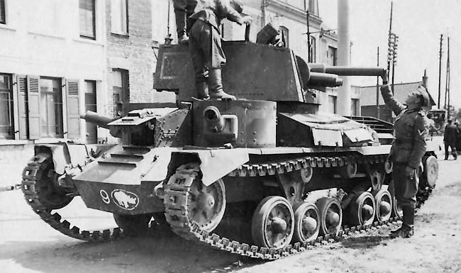 German troops examining a Cruiser Mk1 A9 tank of 'B' Company, 1st Armoured Division, 2nd Armoured Brigade 