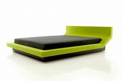 Een luxueus groen bed.