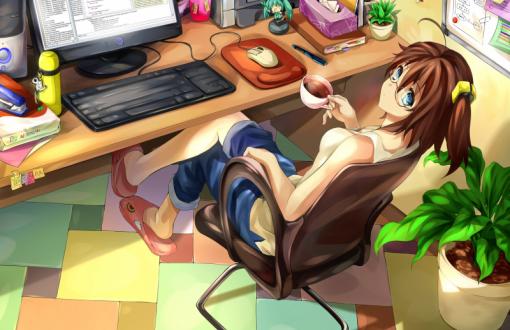 Girl drinking coffee at the desk