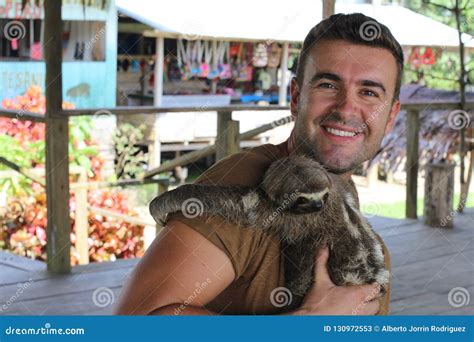 Sloth Hugging a Handsome Man Stock Image - Image of bear, balcony ...