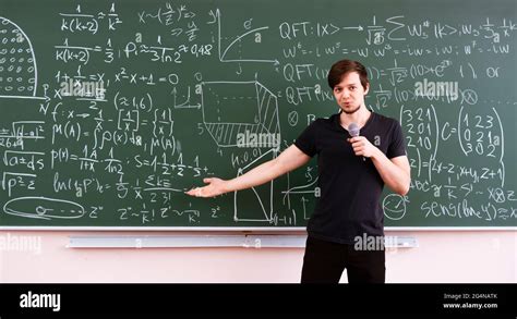 teacher of young professor explains the law of physics for students on ...