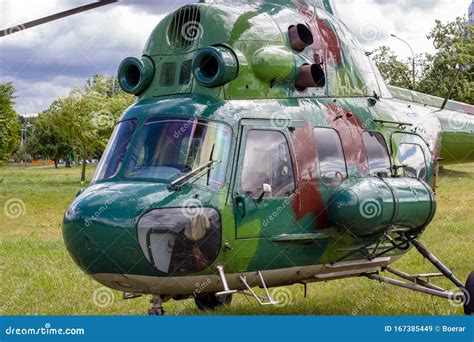 Green Military Helicopter is Landing in the City Street Park. Stock ...