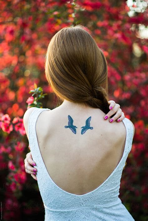 "Woman With Two Birds Tattooed On Her Back" by Stocksy Contributor ...