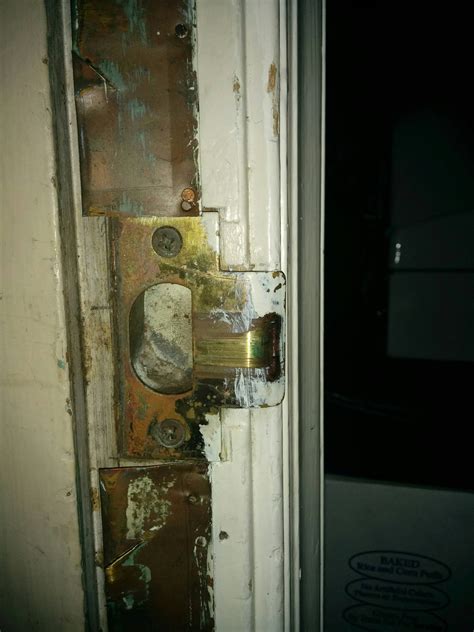 lock - How can I adjust a door latch so that it engages securely ...