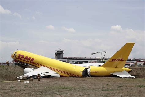 DHL cargo plane skids off runway, breaks during landing: video