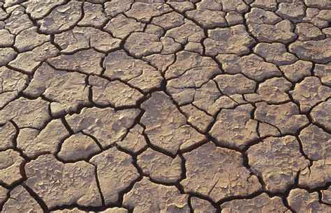 Cracked earth in desert Stock Photo by ©londondeposit 33864691