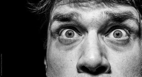 Scared Man Looking Anxiously Into Camera by Urs Siedentop & Co