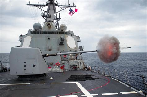 Shell fired from USS Mustin (DDG-89) captured leaving the barrel of her ...