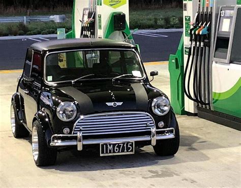 Classic Mini Cooper parked at gas station