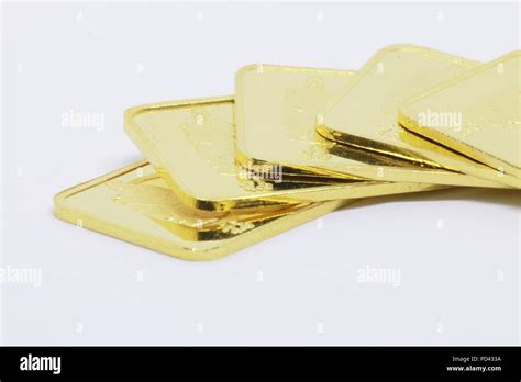 Gold bar ingot close up on the white background Stock Photo - Alamy