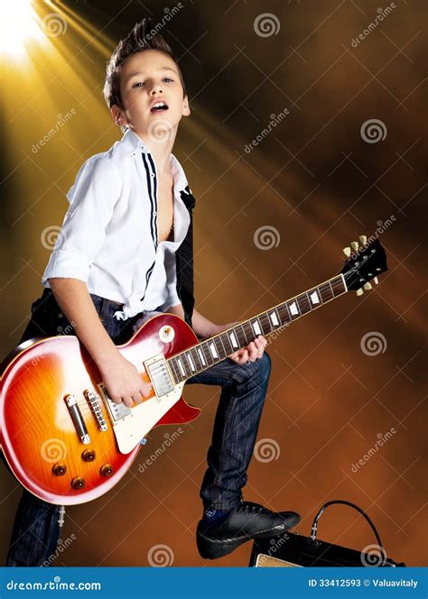 Boy Playing On Electric Guitar On The Stage Stock Photos - Image: 33412593