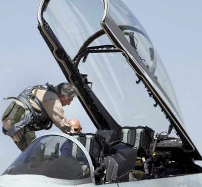 Ratan Tata sits in the cockpit of a F17 fighter plane during the Aero ...