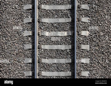 Railway background texture. Steel rails mounted on gray concrete ...