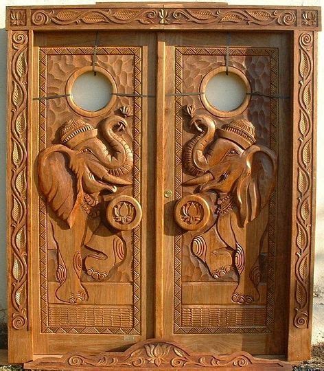 Carved Wooden Doors with Elephants and Lions Design