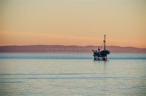 Oil rig at sunset stock image. Image of landscape, girl - 76419731