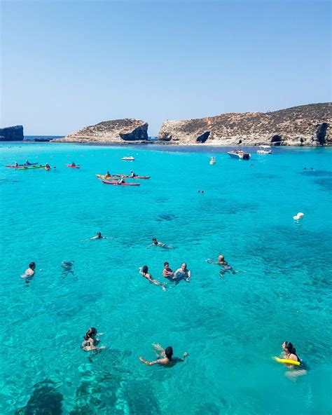 People swimming in the Blue Lagoon, Comino, Malta Malta Travel Guide ...