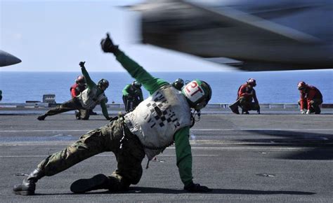 File:US Navy 090624-N-2880M-020 Flight deck personnel give a thumbs-up ...