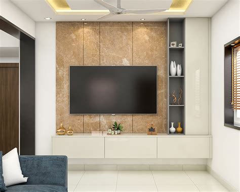 Compact TV Unit Design With Marble Wall Panel And Open Storage | Livspace