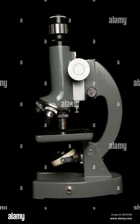 Microscope on black background in studio Stock Photo - Alamy