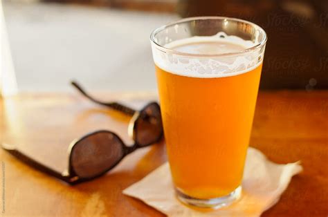 "IPA Beer And Sunglasses" by Stocksy Contributor "CWP, LLC" - Stocksy