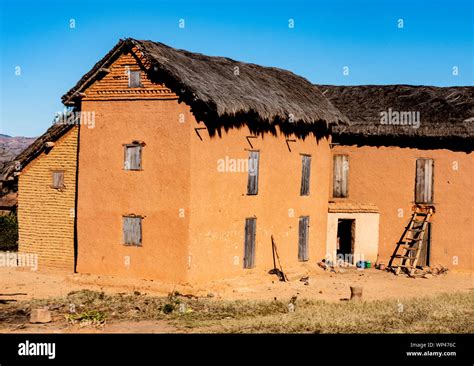 Typical traditional adobe mud brick built thatched two storey houses in ...