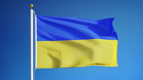 Ukrainian National Flag Waving On Flagpole In Blue Sky. Ukraine Stock ...