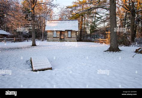 Winter Cabin In The Woods. Snow covered cozy log cabin in a wintry ...