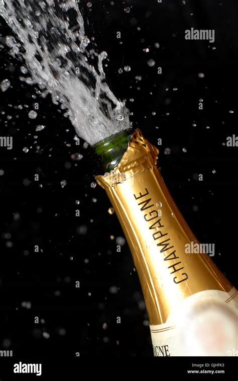 popping champagne bottle Stock Photo - Alamy