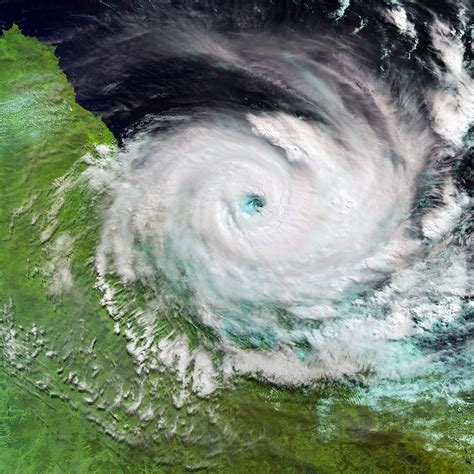 Satellite catches Cyclone Debbie striking Queensland