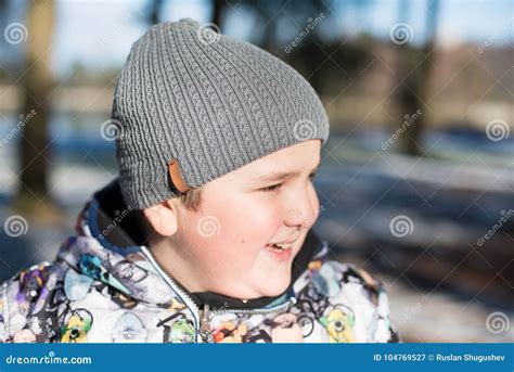 Portrait of Happy Laughing Fat Kid in Cap and Winter Jacket in Park in ...