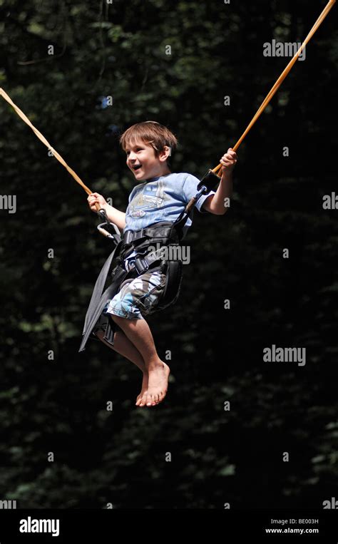 Little boy jumping on the trampoline in the Nuremberg Zoo, Nuremberg ...