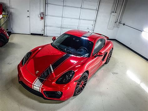 black chrome striped car wrap | Porsche Cayman in for a Full Avery Red ...