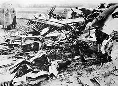 The wreckage of a Halifax bomber of RAF Bomber Command lies in a field ...