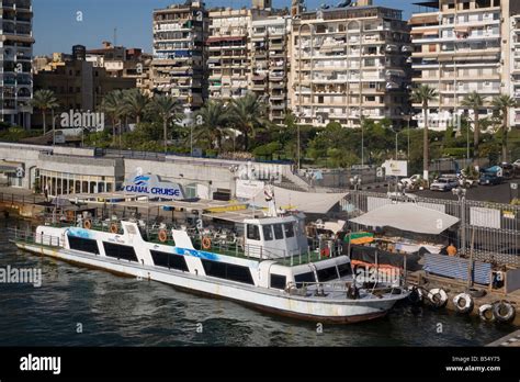 Egypt Port Said Suez canal waterfront & canal cruise boat Stock Photo ...