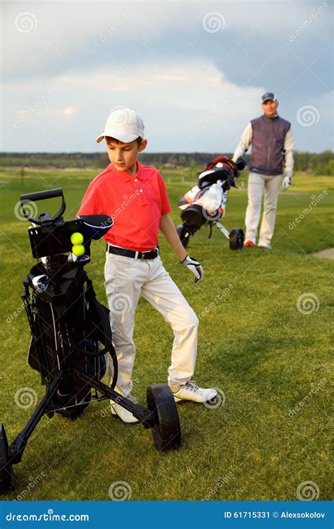 Father with son at golf stock image. Image of green, club - 61715331