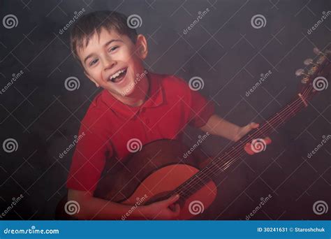 Singing Boy with Acoustic Guitar Stock Image - Image of guitarist ...