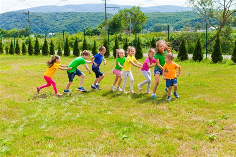 Active children playing yard games | Nature Stock Photos ~ Creative Market