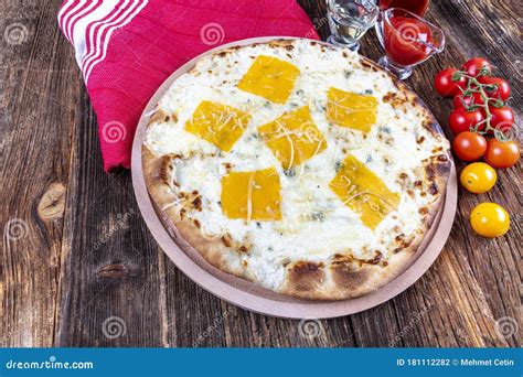 Four Types of Cheese Italian Pizza on a Wooden Floor Stock Photo ...