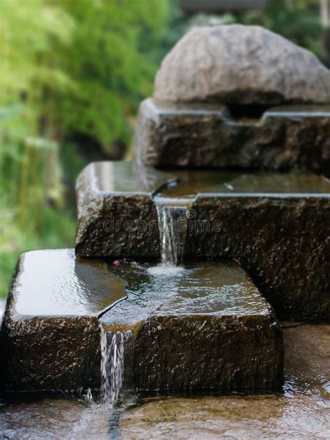 Beautiful Three-tiered Stone Waterfall. Water Flowing Over Rocks Stock ...