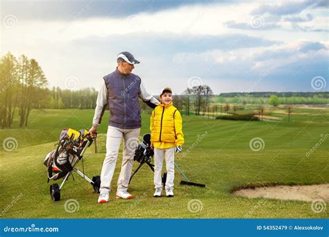 Father with son at golf stock image. Image of parent - 54352479