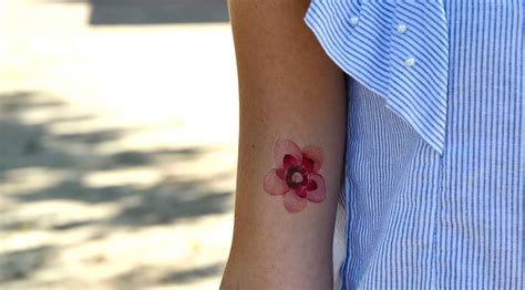 Pink watercolor flower tattoo