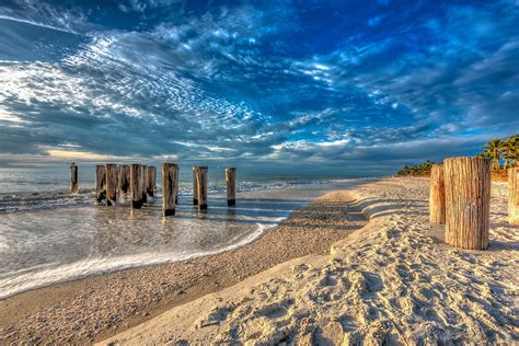 Naples beach sunset Photograph by Stan Dzugan - Pixels