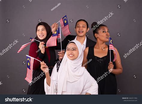 Happy Multi Racial Malaysian People Holding Stock Photo 1602311992 ...