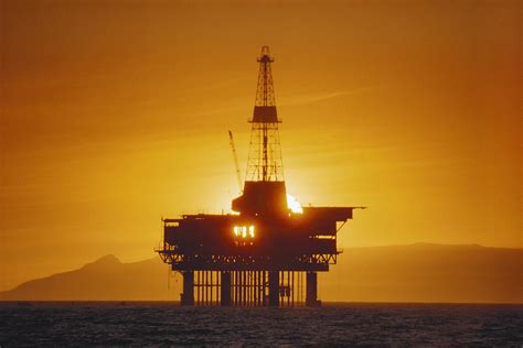 Offshore Oil Rig At Sunset Photograph by Jack Fields | Pixels