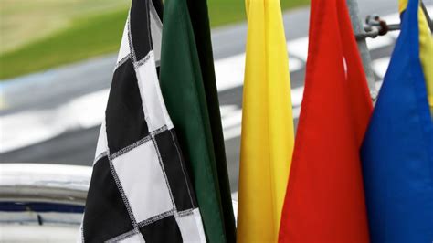 Race Car Flags: What Do the Colors Mean? - AxleAddict