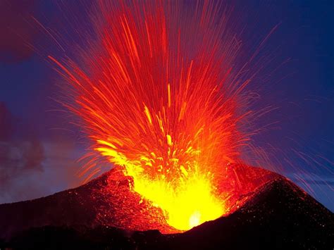 an active volcano spewing lava into the air